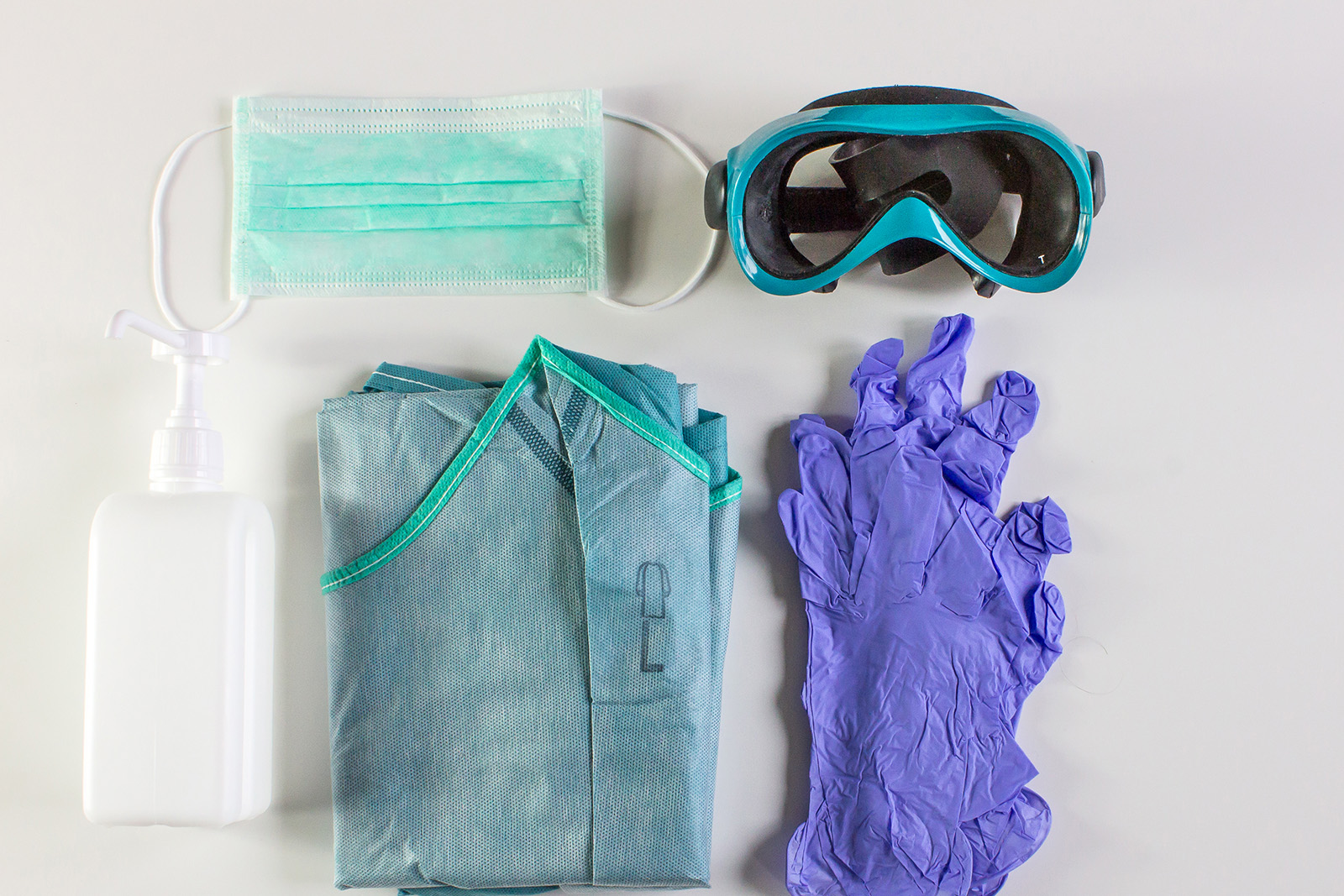 Health care PPE including mask, goggles, hand sanitizer, gown, and gloves