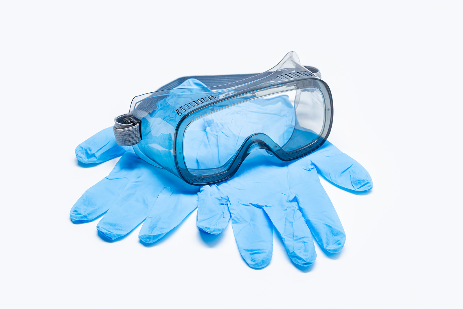 Safety googles and blue latex gloves