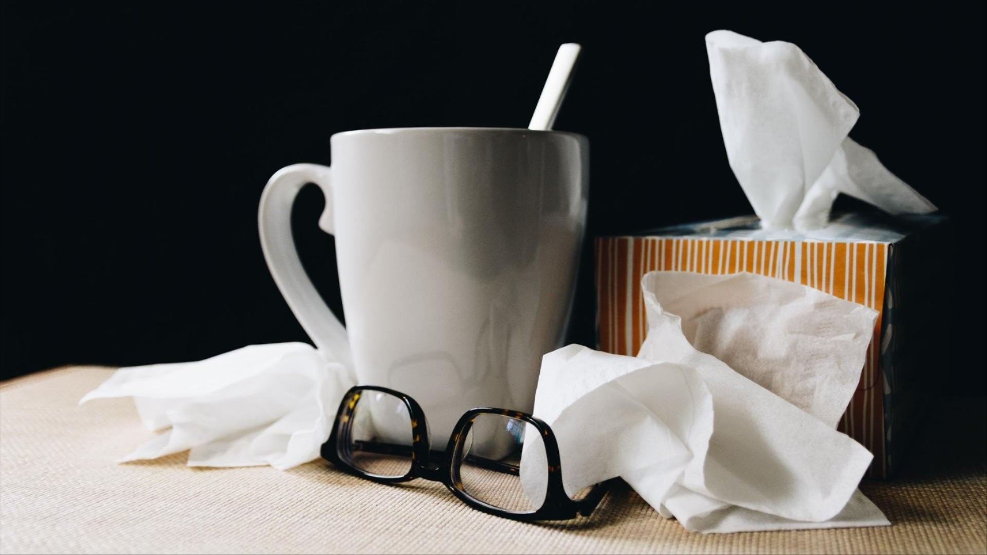 mug, eye-glasses, and tissues