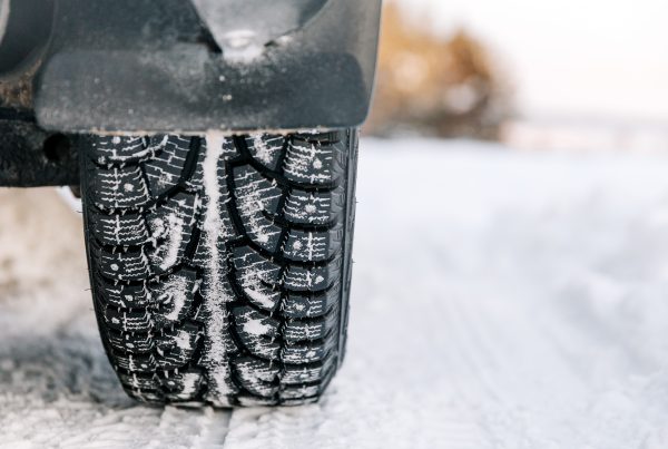 close up of car tire in snow