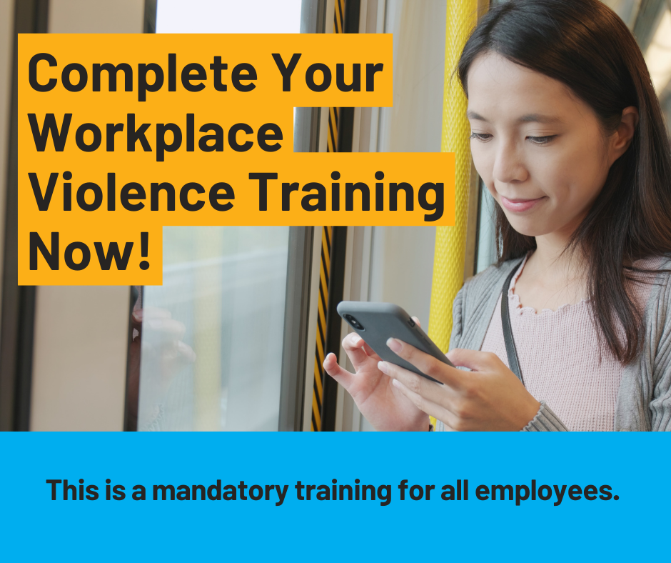 woman looking at her phone. Text reads: "Complete your workplace violence training now! This is a mandatory training for all employees."