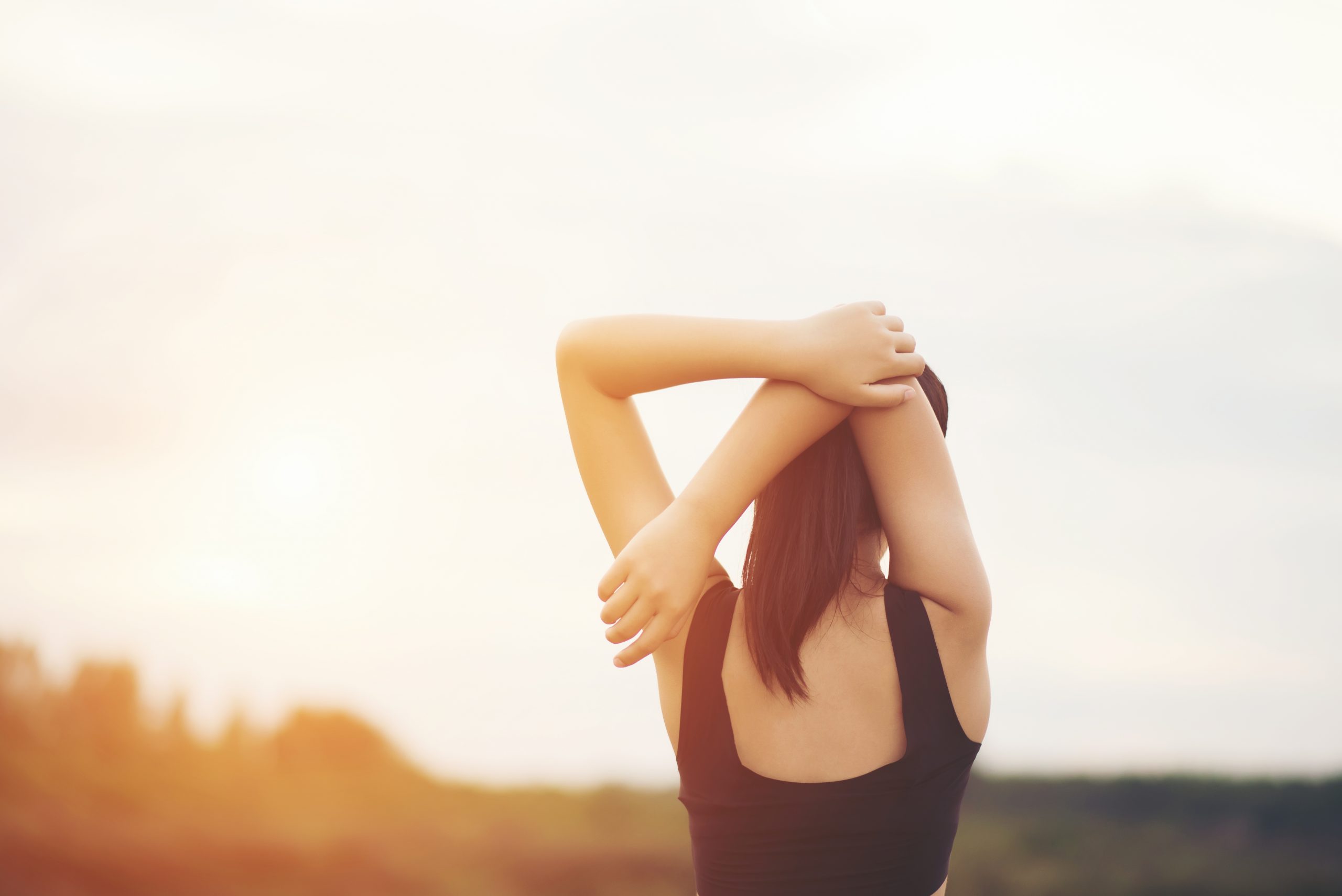 woman stretching her back