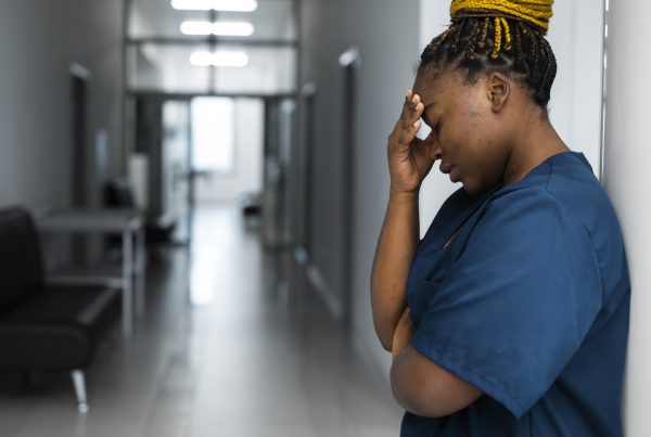 tired woman wearing scrubs