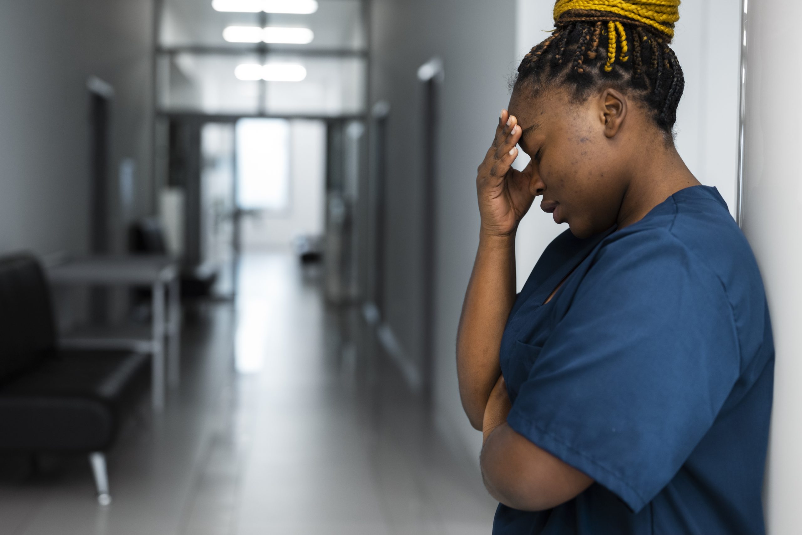 tired woman wearing scrubs