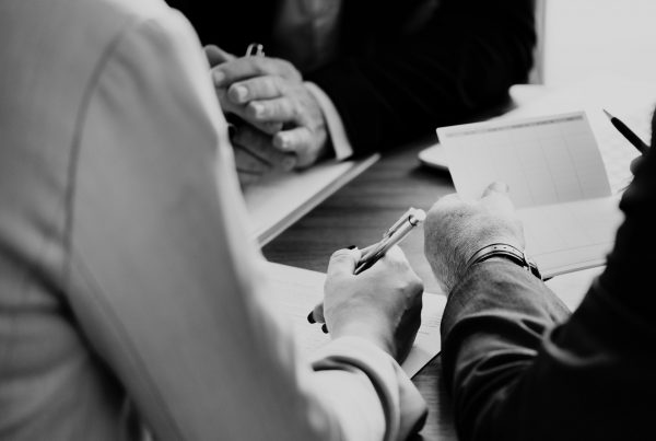 black and white photo of people working together