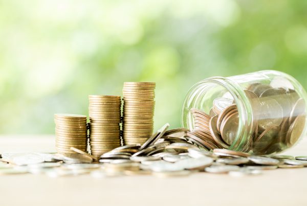 coins spilling out of a jar