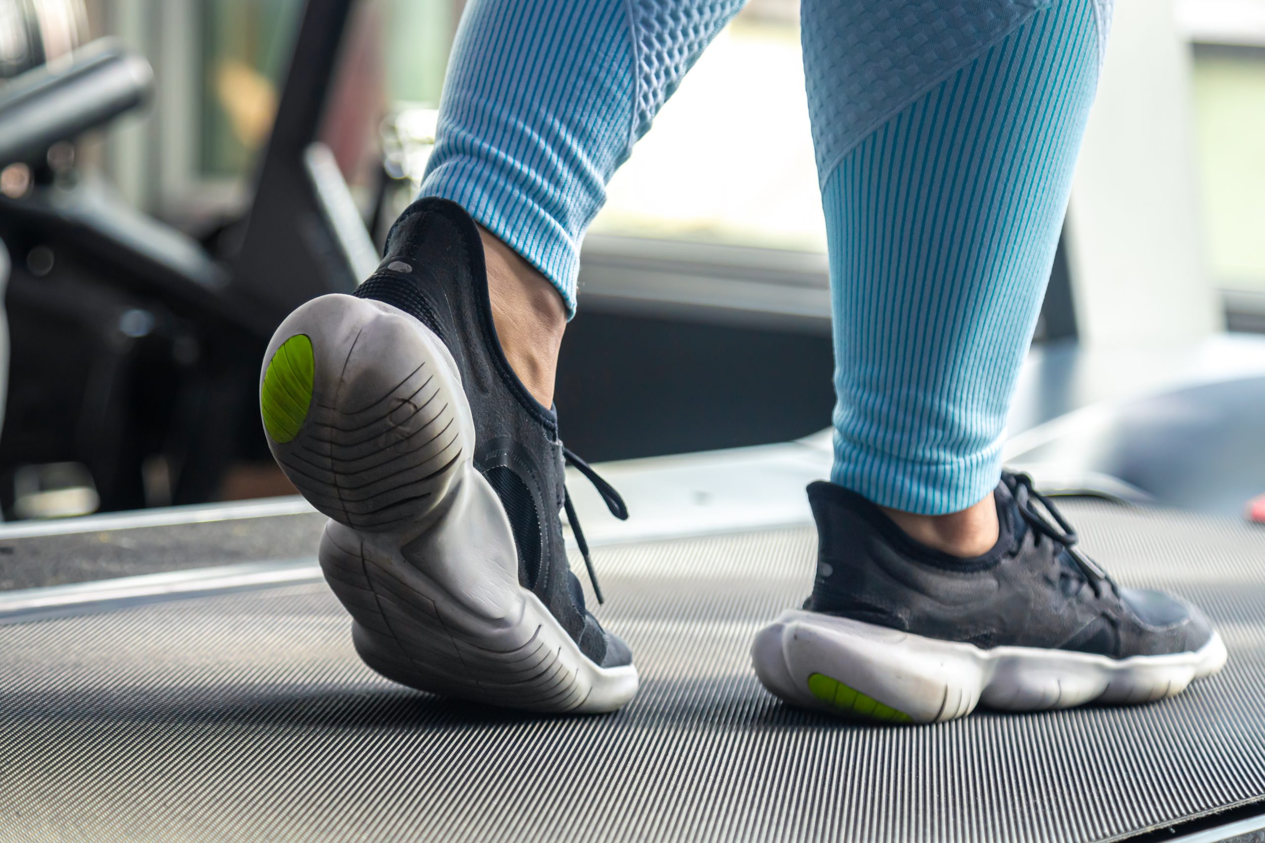 close up woman's shoes on treadmill